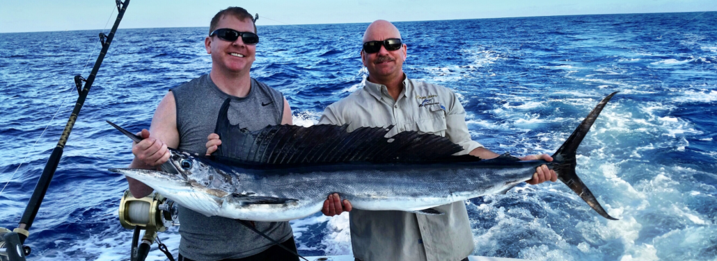 guys holding their catch for a trophy photo